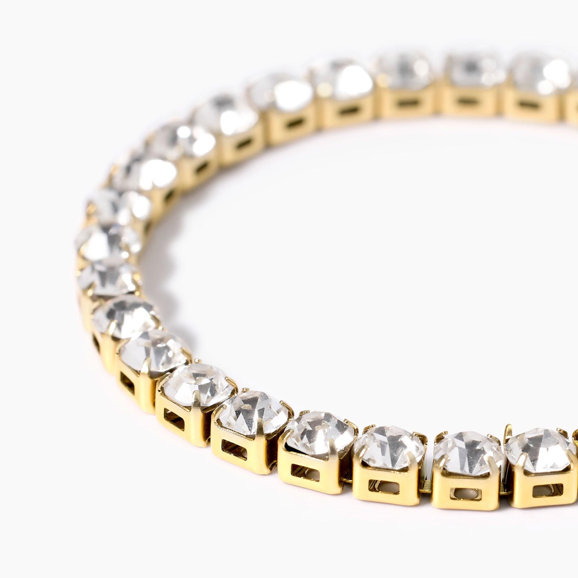 Bracciale tennis dorato con cristalli bianchi