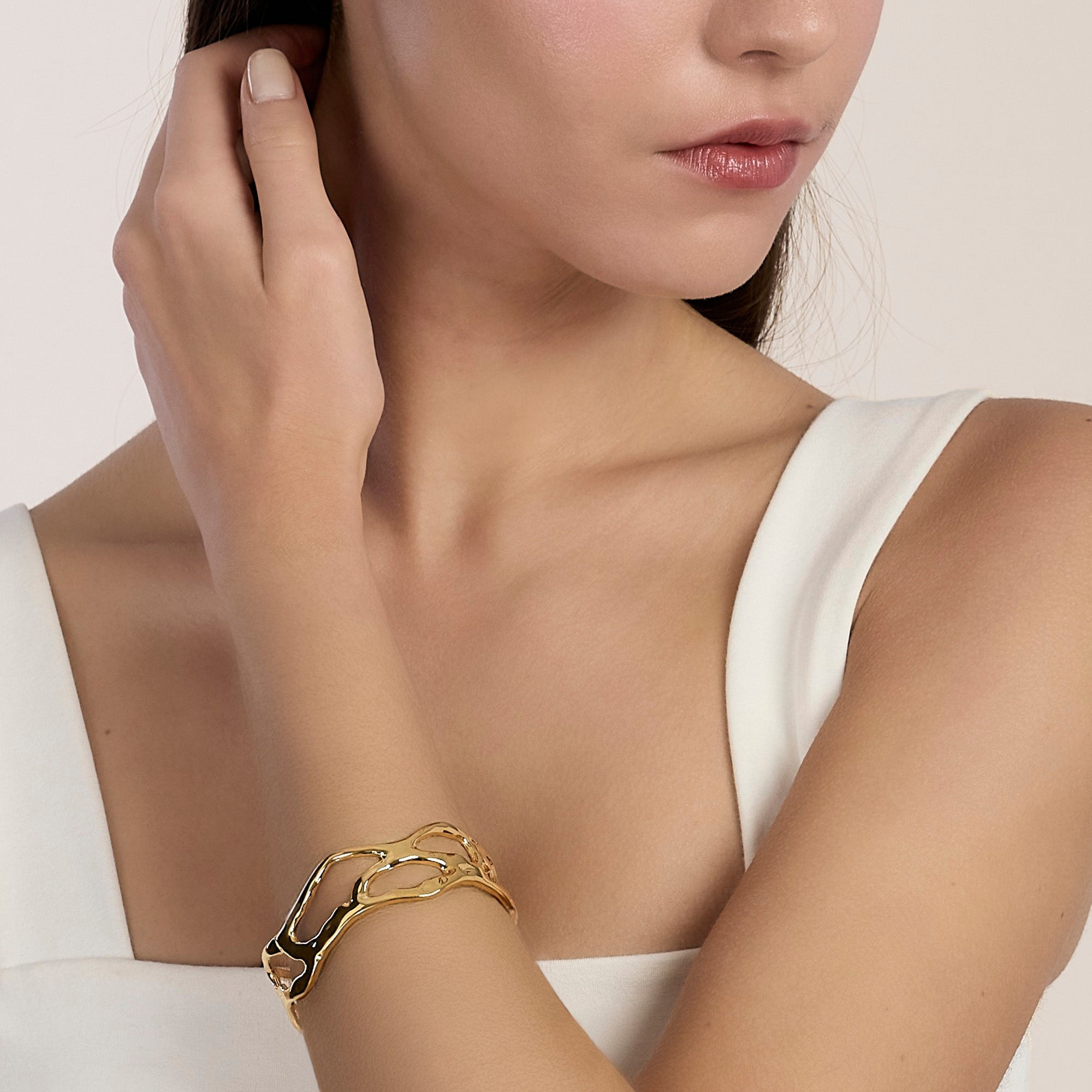 Bracciale cuff in acciaio dorato