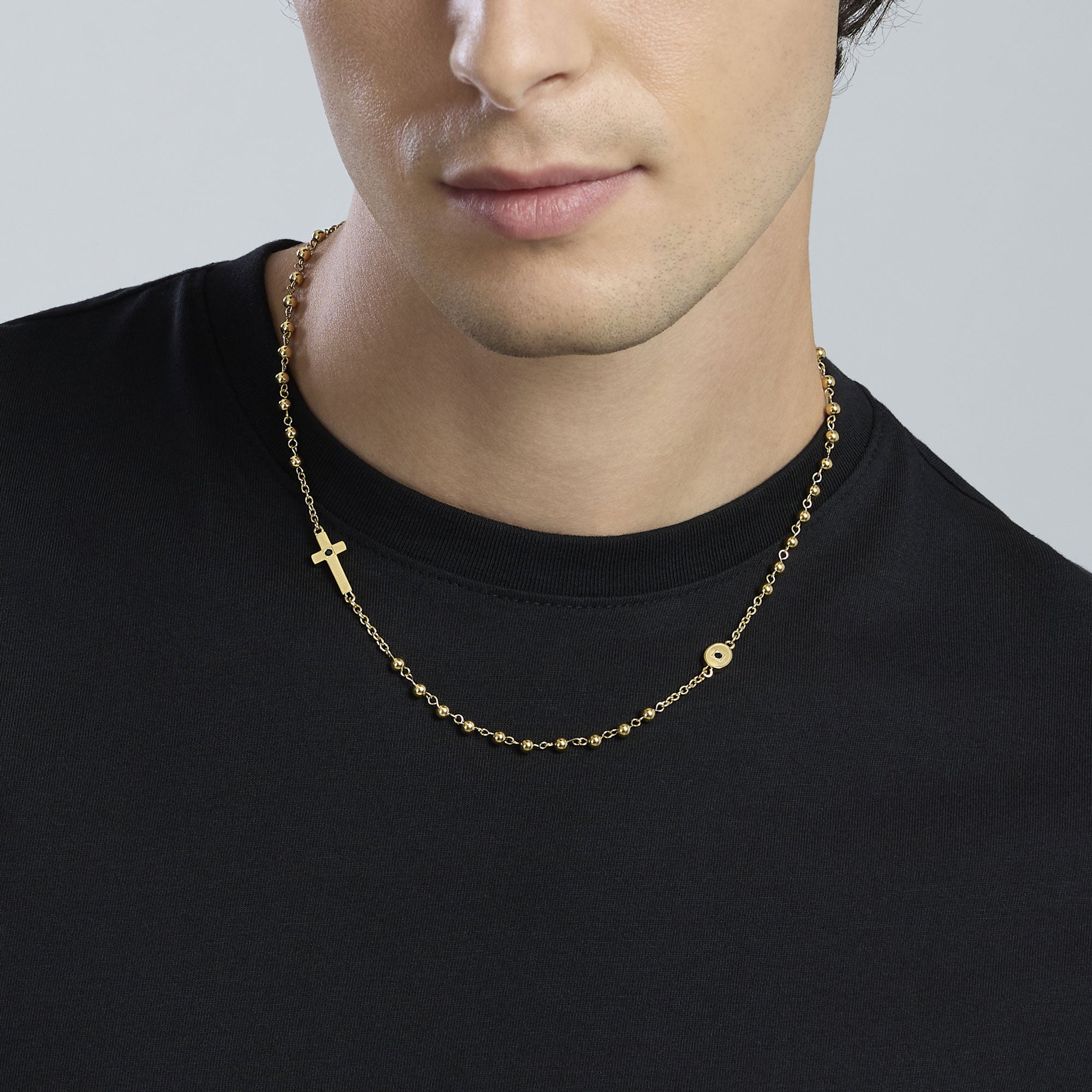 Collana in acciaio dorato con croce